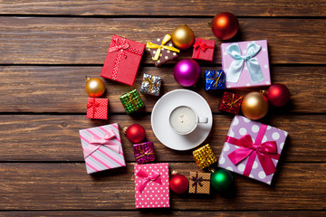 Cup of coffee and Christmas gifts