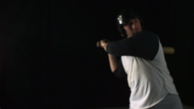 Baseball player hitting ball with bat shooting with high speed camera, phantom flex.
