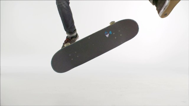 Skater rolling into kickflip trick shooting with high speed camera, phantom flex.