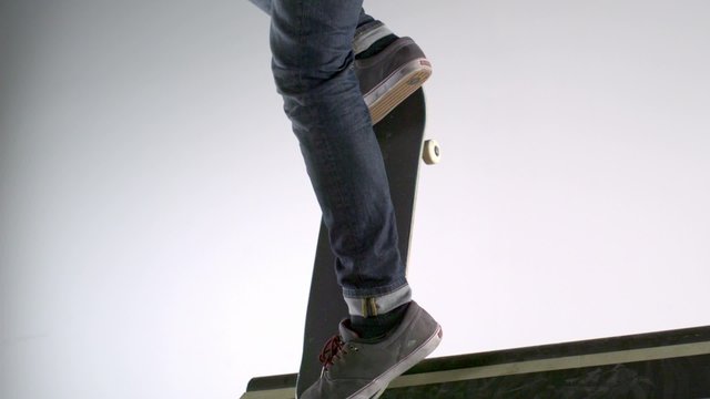 Skater dropping in on ramp shooting with high speed camera, phantom flex.