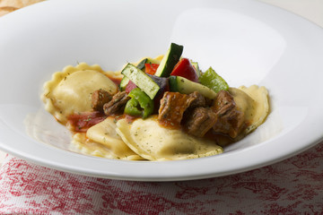 fresh meat tortellini with tomato and sauteed vegetables