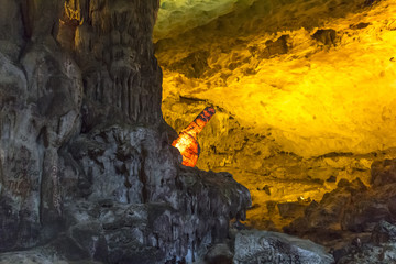 Pointing finger inside cave, Halong Bay