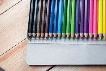 Fototapeta premium coloured pencil on the wood floor