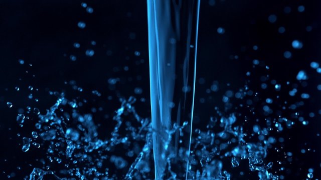 Blue water splash on black background shot with high speed camera, phantom flex.