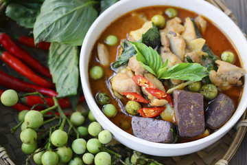 Thai chicken green curry with old wooden background