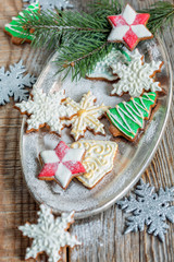 Tray of Christmas cookies and spruce branches.