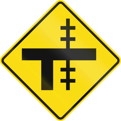 Obraz premium New Zealand road sign - Level crossing on uncontrolled T-junction on right