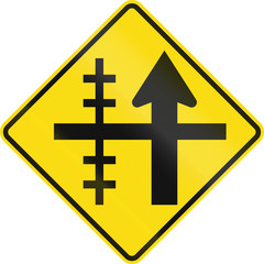 Obraz premium New Zealand road sign - Level crossing on controlled crossroad on left