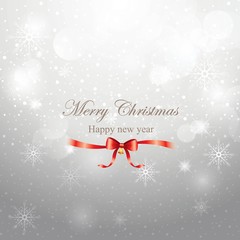 Fototapeta na wymiar Merry Christmas greeting on grey background with snowflakes and red ribbon