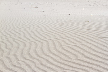Background of sand texture. Wavy texture of bright yellow coral sand for background.