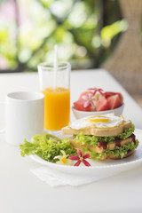 breakfast set with egg sandwich and fruit salad