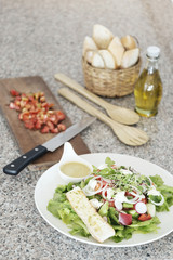 greek salad set with bread and olive oil
