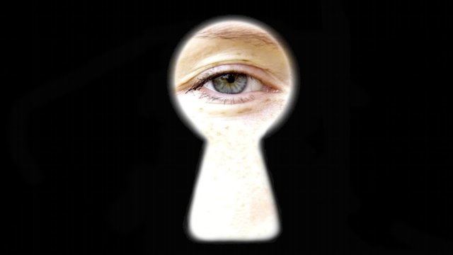 Eye blinking looking at You watching through key hole spying door trying find out secrets attention violating privacy 
