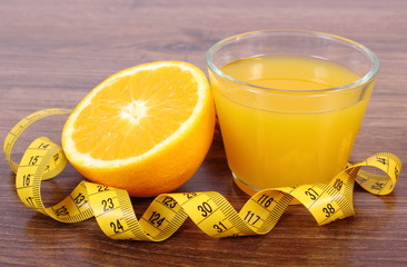Fresh orange, juice and tape measure, healthy lifestyles and nutrition