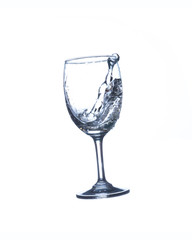 Concept of drinking. Wine glass with splash water on white background