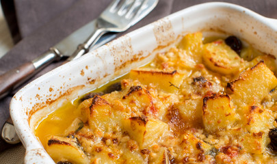 Fish with potatoes  and olives cooked in oven