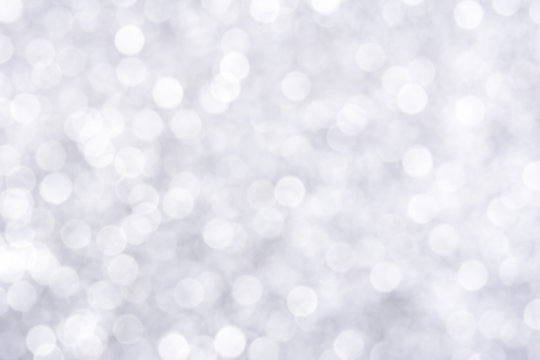 Sparkle glittering white bokeh abstract background