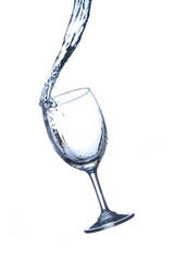 Concept of drinking. Wine glass with splash water on white background