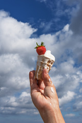 Ice cream in hand.