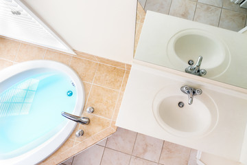 Interior Architecture of Full Bathtub and Acrylic Sink
