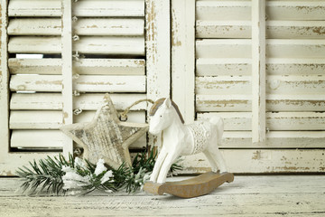  wooden rocking horse on a wooden rustic background