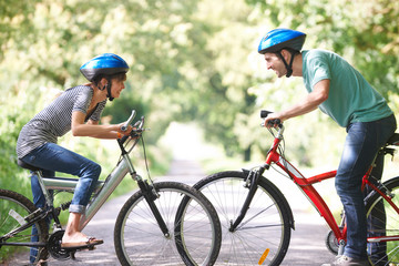Fototapeta na wymiar Young Couple Cycling On Country Road