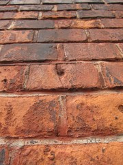 detail of old wall made of red bricks