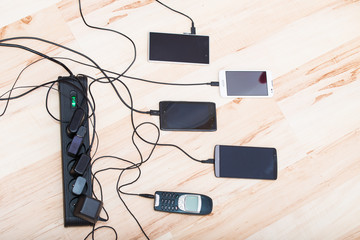 four smartphones and one classic phone © Artur Golbert