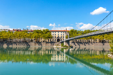Fototapeta premium Cityscape of Lyon, France with reflections in the water