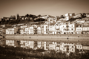 Obraz premium View of city Alcacer do Sal near the river Sado in Portugal