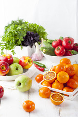 Fresh fruits, vegetables and herbs variety Wooden background