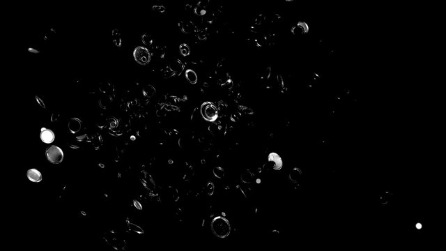 Round shape silver confetti fly after being exploded against black background. Shot with high speed camera, phantom flex 4K. 4K 30fps. Slow Motion.