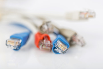 Colorful network cable with RJ45 connectors. Selective focus.