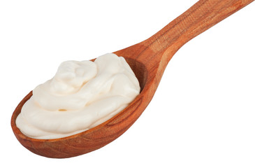 Handful of mayonnaise in wooden spoon isolate