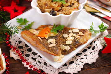 fried carp with almonds and sauerkraut for christmas eve