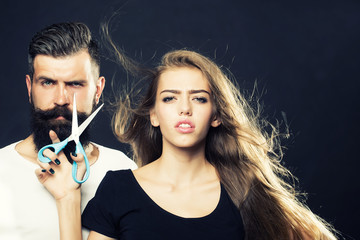 Obraz premium Fashionable couple with scissors