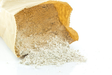 Whole wheat flour in bag on white background