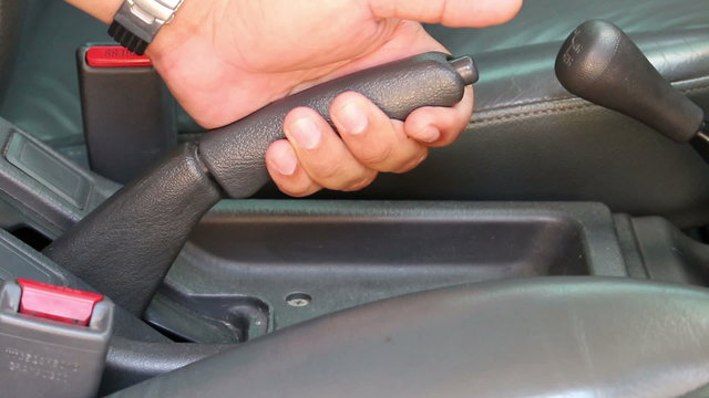 pulling handbrake of a car