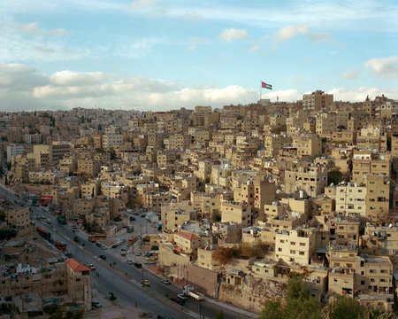 Amman city view with Jordanian flag