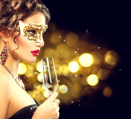 Sexy model woman with glass of champagne wearing venetian masquerade mask © Subbotina Anna