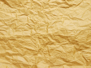 Old blank crumpled paper in yellow tone