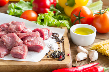 Raw, fresh beef with vegetables