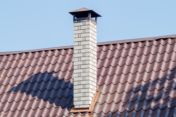 brick chimney on the roof
