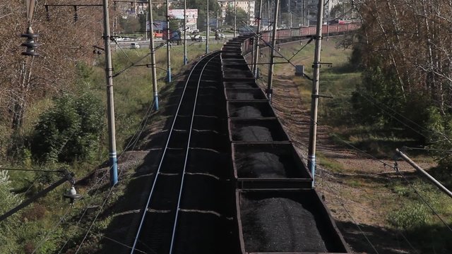 Freight train with cargo containers passing by