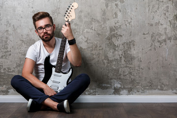 Stylish guy with a guitar