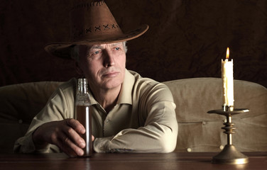 Mature man in cowboy hat