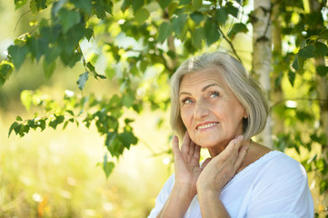 senior woman in summer park