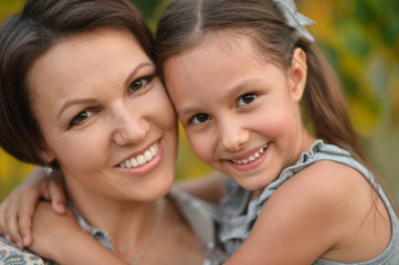 girl with mother in park