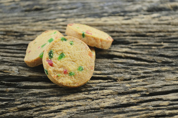 Mixed fruits cookies on old wooden background