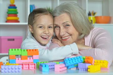 Grandmother with granddaughter playing together